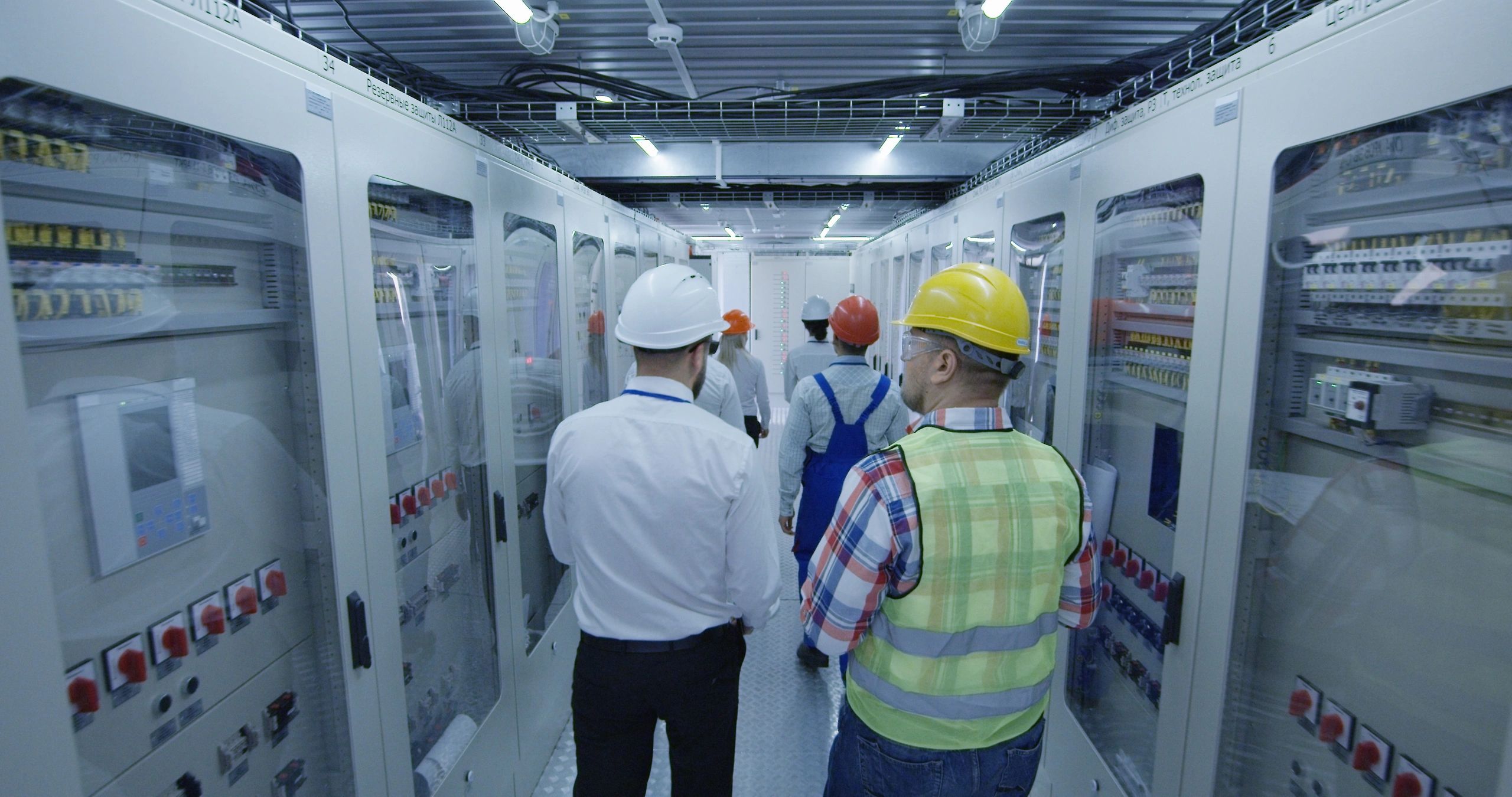 Commercial maintenance team reviewing building systems