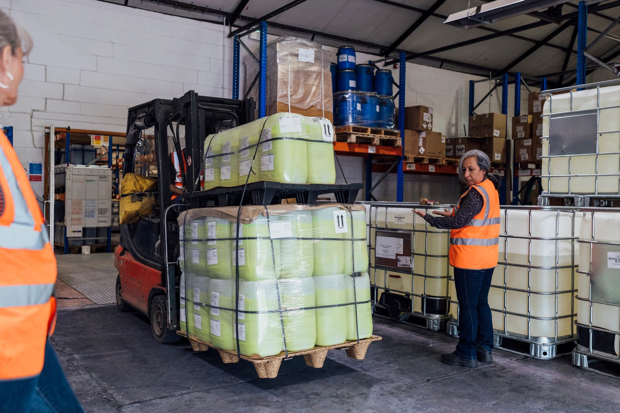 Team members working together in a warehouse setting