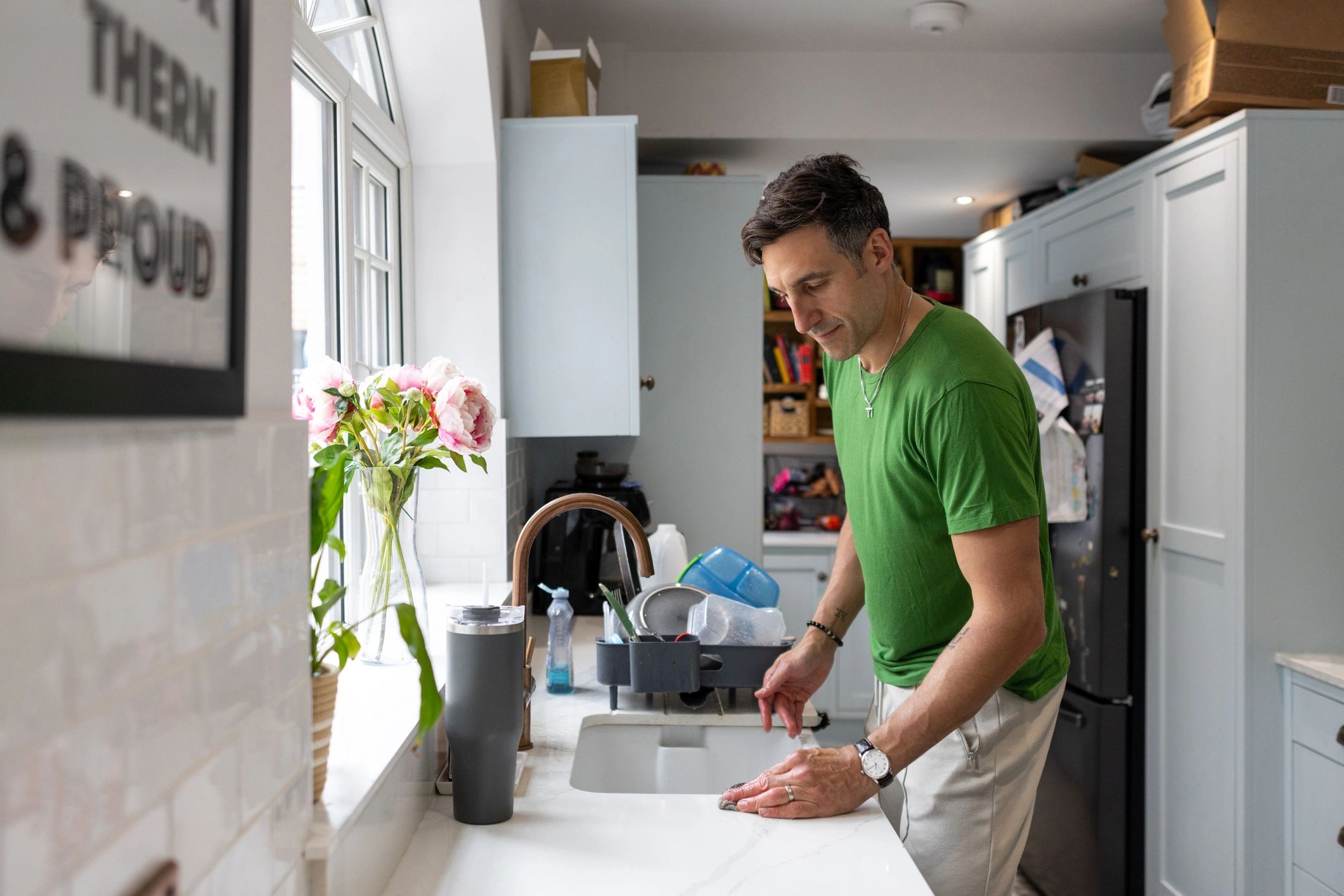 Technician working at a kitchen sink